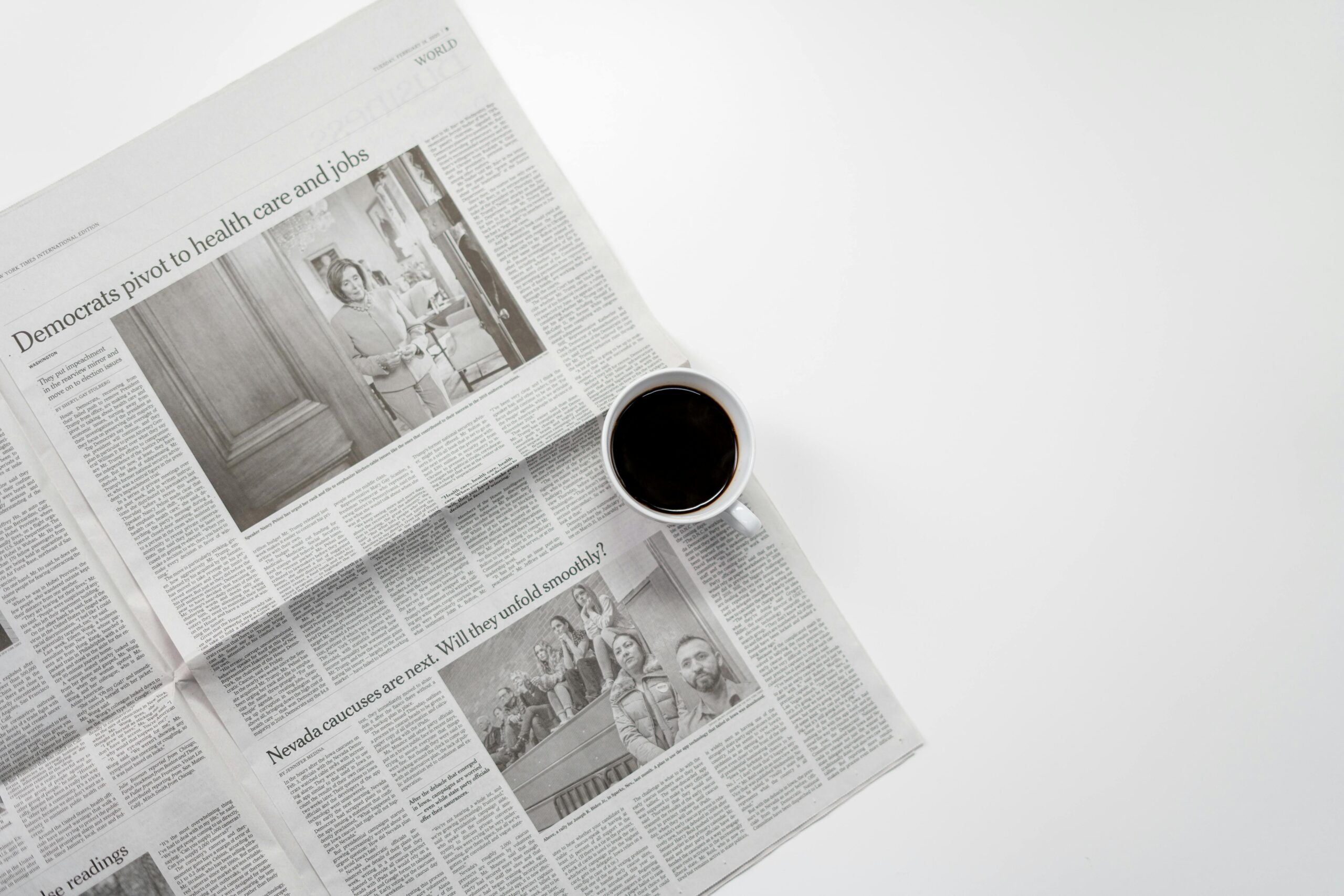 Daily Feed A fresh cup of coffee resting on a newspaper, perfect morning routine setup.